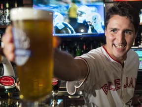 Justin Trudeau holding a pint of beer