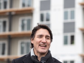 Justin Trudeau smiles during outside press conference