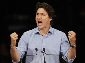 Justin Trudeau first clenched, mouth open while on stage