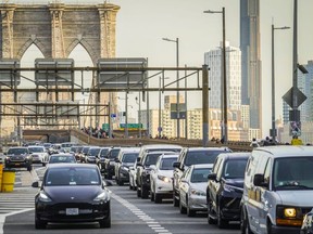 Traffic enters lower Manhattan after crossing the Brooklyn Bridge, Thursday, Feb. 8, 2024, in New York. The Big Apple is close to implementing a plan that would use license-plate readers to turn all of Manhattan south of Central Park into one giant toll zone.
