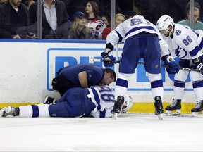 Mikhail Sergachev of the Tampa Bay Lightning lies on the ice after an injury during the second period against the New York Rangers at Madison Square Garden on Feb. 7, 2024 in New York City.