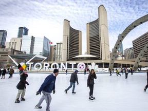 Enjoying a skate at Nathan Phillips Square in front of City Hall in Toronto, Ont., on Sunday, Feb. 20, 2022.