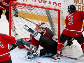 PWHL Boston defender Sophie Jaques crashes into PWHL Ottawa goalie Emerance Maschmeyer.