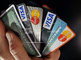 Consumer credit cards are posed.