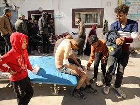 Palestinians receive medical care at Kamal Edwan Hospital in Beit Lahia, in the northern Gaza Strip, on Thursday, Feb. 29, 2024, after Israeli soldiers allegedly opened fire at Gaza residents who rushed towards trucks loaded with humanitarian aid amid ongoing battles between Israel and the militant Hamas group.