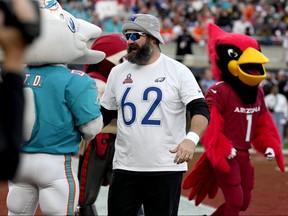 NFC centre Jason Kelce, of the Philadelphia Eagles, laughs with team mascot during the flag football event at the NFL Pro Bowl football game, Sunday, Feb. 4, 2024, in Orlando.