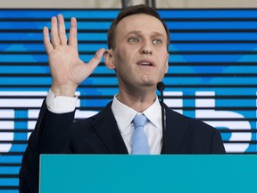 Russian opposition leader Alexei Navalny gestures while speaking during his supporters' meeting that nominated him for the presidential election race in Moscow, Russia on Dec. 24, 2017. (AP Photo/Pavel Golovkin, File)