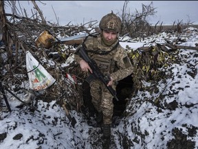 A Ukrainian soldier takes his position on the frontline near Klishchiivka the Donetsk region, Ukraine, Friday, Feb. 19, 2024.