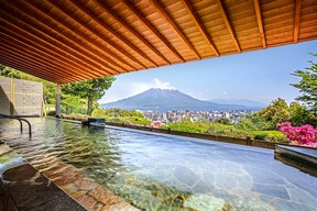 Mount Sukurajima can be seen from the outdoor onsen at the Shiroyama Hotel.
