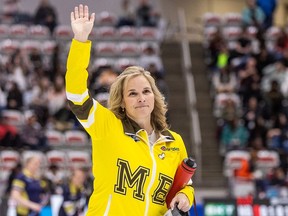 Manitoba’s Jennifer Jones waves to the crowd after winning Draw 16 against Ontario-Inglis in the Scotties Tournament of Hearts at WinSport Arena in Calgary on Thursday, Feb. 22, 2024.