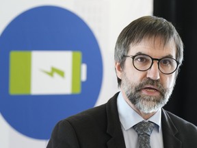 Environment Minister Steven Guilbeault speaks at an announcement in Toronto on Tuesday, Dec. 19, 2023, where he outlined the details of his plan to eventually phase out the sale of gas-powered vehicles in Canada.