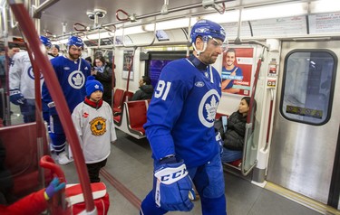 Toronto Maple Leafs captain John Tavares takes the subway with his teammates to the team’s annual outdoor practice at Nathan Phillips Square in Toronto on Thursday, Feb. 8, 2024.
