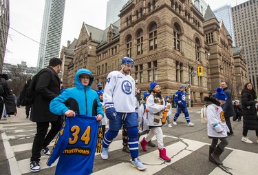 Toronto Maple Leafs star Auston Matthews makes his way to the team’s annual outdoor practice at Nathan Phillips Square alongside fans.