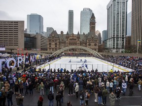 Fans watch the Toronto Maple Leafs during their annual outdoor practice at Nathan Phillips Square.