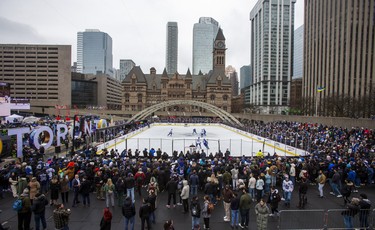 Fans watch the Toronto Maple Leafs during their annual outdoor practice at Nathan Phillips Square.