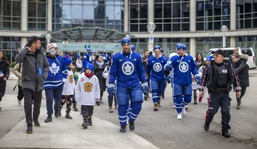Toronto Maple Leafs captain John Tavares and his teammates make their way to the team’s annual outdoor practice.