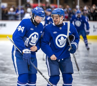 Toronto Maple Leafs Morgan Rielly and Max Domi share a laugh.