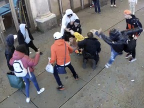 This image from video provided by the Office of the Manhattan District Attorney, Thursday, Feb. 8, 2024, shows the brawl between New York City Police Department officers and migrants in Times Square, Jan. 27, 2024.