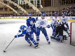 Toronto Maple Leafs practice on outdoor rink