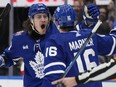Maple Leafs winger Tyler Bertuzzi celebrates teammate Mitchell Marner's goal with teammate against the Red Wings in Toronto, Jan. 14, 2024. Bertuzzi scored a goal, his first in 20 games, against the Ducks on Saturday, ending a slump.