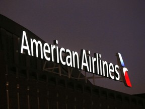 FILE - The American Airlines logo is seen atop the American Airlines Center, Dec. 19, 2017, in Dallas. Federal safety officials said Monday, Feb. 12, 2024, that they are investigating an incident in which an American Airlines jet had a braking problem and ran off the end of the runway after landing at Dallas-Fort Worth International Airport.