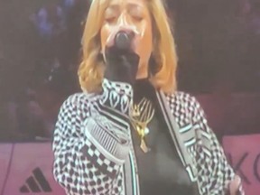 A singer wearing pro-Palestinian colours, with a history of anti-Israel rants, performed the American national anthem at the All-Star Game.