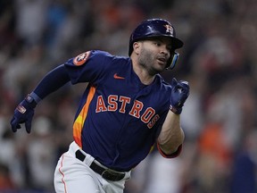 Houston Astros' Jose Altuve runs after his 2,000th career hit, a single off Seattle Mariners starting pitcher Logan Gilbert, during the fifth inning of a baseball game Aug. 19, 2023, in Houston.