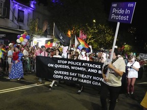 Participants march in the 45th Anniversary Sydney Gay and Lesbian Mardi Gras Parade in Oxford Street, Sydney, Australia, Feb. 25, 2023.