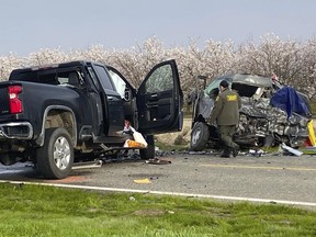The site of a head-on crash involving a van and a pickup truck