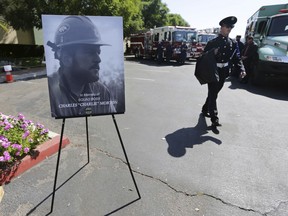 Firefighters arrive to attend a memorial for Charles Morton, the U.S. Forest Service firefighter assigned to the Big Bear Hotshots who was killed in the line of duty on Sept. 17 on the El Dorado Fire, Sept. 25, 2020 at The Rock Church in San Bernardino, Calif.