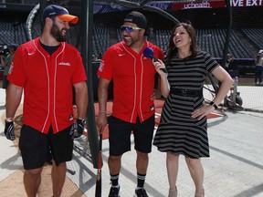 FILE - Colorado Rockies television announcer Jenny Cavnar, right, jokes with Vinny Castilla, center, special assistant to the Rockies general manager, and Denver Broncos fullback Andy Janovich, June 11, 2019, in Denver. Cavnar is the new primary play-by-play announcer for the Oakland Athletics, hired by NBC Sports California. The company made the announcement Tuesday, Feb. 13, 2024.