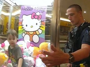 A toddler is pictured inside a claw machine at a mall in Australia in a screengrab of a video shared on X by Queensland Police.