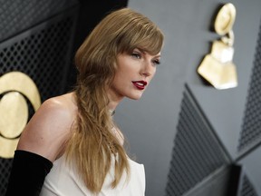 FILE - Taylor Swift arrives at the 66th annual Grammy Awards on Feb. 4, 2024, in Los Angeles. Some conservatives on cable news or on social media have speculated that Taylor Swift is part of an elaborate plot to help Democrats win the November election. However, on the campaign trail, many voters just see that talk as noise to tune out.