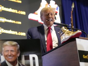 Republican presidential candidate former President Donald Trump attends Sneaker Con Philadelphia, an event popular among sneaker collectors, in Philadelphia, Saturday, Feb. 17, 2024. Trump announced a line of shoes bearing his name.