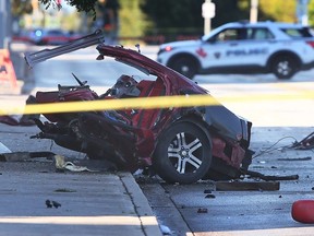 Part of a destroyed vehicle is shown on Riverside Drive near McDougall Street on Sunday, Oct. 15, 2023. Ontario's Special Investigations Unit was called in to investigate the double-fatal crash that occurred at approximately 2 a.m. that morning.