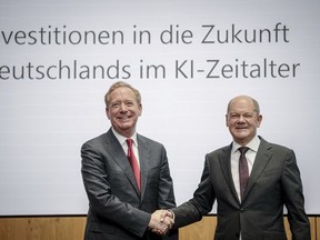 Federal Chancellor Olaf Scholz, right, and Vice Chair and President of Microsoft Corporation Brad Smith