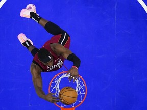 Miami Heat's Bam Adebayo dunks against the Philadelphia 76ers during the second half of an NBA basketball game, Wednesday, Feb. 14, 2024, in Philadelphia.