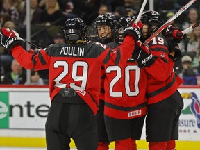 For the second year in a row, Canada has comeback from a 3-0 deficit to win the Rivalry Series against the United States. Canada players celebrates after a goal by Natalie Spooner (24) against the United States in the first period of a women's Rivalry Series hockey game, in St. Paul, Minn.,&ampnbsp;Sunday, Feb. 11, 2024.