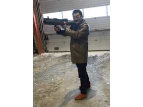 This image provided by the U.S. Attorney, Southern District of New York shows a photo from a complaint document filed by SDNY that shows Takeshi Ebisawa handling a rocket launcher.