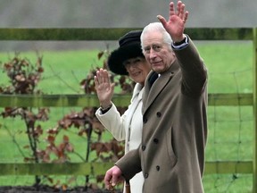 King Charles III and Queen Camilla waves as they leave after attending a service at St. Mary Magdalene Church on the Sandringham Estate in eastern England on Feb. 11, 2024.