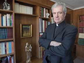 Archbishop Christian Lépine is seen in his office Wednesday, March 27, 2019, in Montreal. The Roman Catholic Archbishop of Montreal has filed a legal challenge to Quebec's end-of-life legislation, arguing it violates religious freedom.
