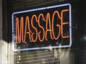 A red neon massage sign.