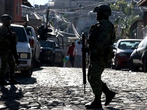 Members of the Mexican Army guard the area where six people were killed in an attack, resulting in two more people being injured, in Tlaquepaque, Jalisco State, Mexico, on Feb. 18, 2024.