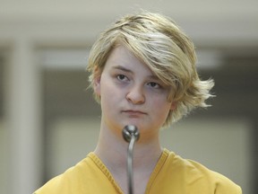 FILE - Denali Brehmer stands at her arraignment in the Anchorage Correctional Center in Anchorage, Alaska, on June 9, 2019. Brehmer, 24, was sentenced earlier this week to 99 years in prison for orchestrating the death of a developmentally disabled woman in a murder-for-hire plot, hoping to cash in on a $9 million offer from a Midwestern man purporting to be a millionaire.