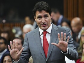 Justin Trudeau speakings with palms facing outward