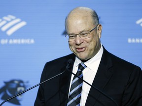 Carolina Panthers owner David Tepper introduces Dave Canales as the NFL football team's new head coach at a press conference in Charlotte, N.C., Thursday, Feb. 1, 2024.