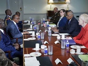 Kenya's Defence Minister Aden Duale, centre left, speaks during a meeting with Defense Secretary Lloyd Austin, centre right, at the Pentagon in Washington, Wednesday, Feb. 7, 2024.