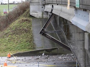 Damage to the 112th Street overpass on Highway 99 after it was struck by a truck carrying large girders on Dec. 28, 2023.