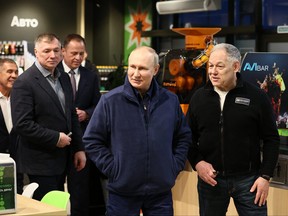In this pool photograph distributed by Russian state agency Sputnik, Russia's President Vladimir Putin visits a roadside service area of M12 Vostok Highway in the Tatarstan Republic on Feb. 22, 2024.