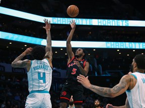 Immanuel Quickley of the Raptors attempts a jump shot during the first half against the Charlotte Hornets at Spectrum Center on Feb. 7, 2024 in Charlotte, N.C.